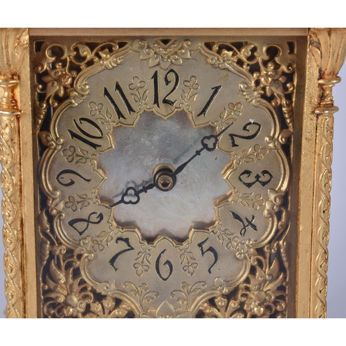 467 - A BRONZE RETICULATED CARRIAGE CLOCK. 19 cm high.