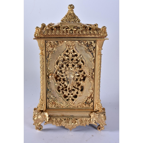 467 - A BRONZE RETICULATED CARRIAGE CLOCK. 19 cm high.