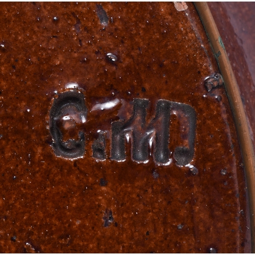 48 - AN EXTREMELY RARE ANTIQUE RUSSIAN TREACLE GLAZED POTTERY PLATE. 21.5 cm wide.