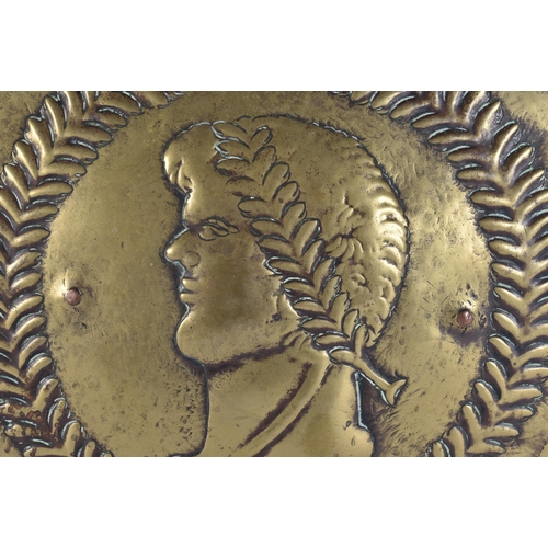 562 - A 17TH/18TH CENTURY CONTINENTAL RELIEF PORTRAIT BRASS PLAQUE. 32 cm wide.
