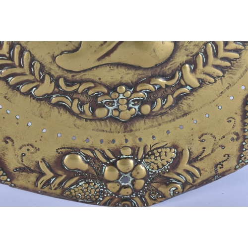 562 - A 17TH/18TH CENTURY CONTINENTAL RELIEF PORTRAIT BRASS PLAQUE. 32 cm wide.