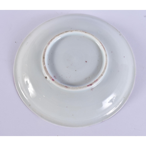 587 - A LATE 19TH CENTURY CHINESE STRAITS PORCELAIN SAUCER together with a jade amulet. Largest 14 cm wide... 