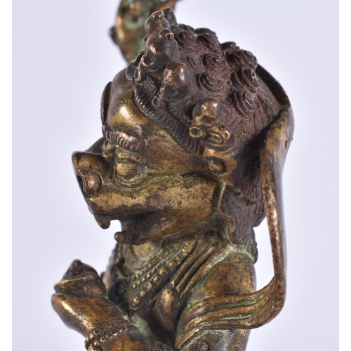 60D - AN 18TH/19TH CENTURY TIBETAN GILT BRONZE FIGURE OF A BUDDHIST DEITY modelled upon a triangular base ... 