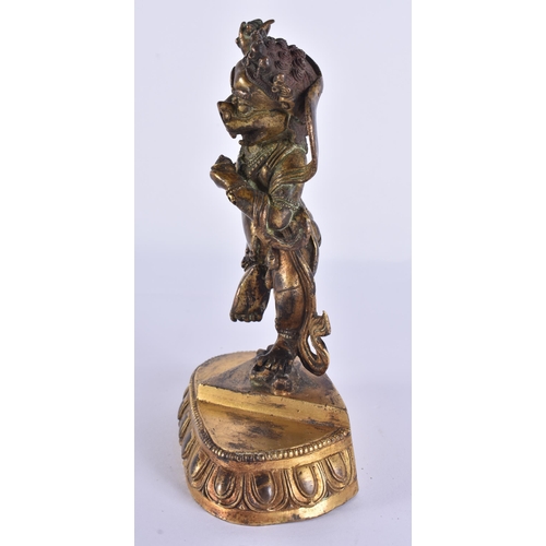 60D - AN 18TH/19TH CENTURY TIBETAN GILT BRONZE FIGURE OF A BUDDHIST DEITY modelled upon a triangular base ... 