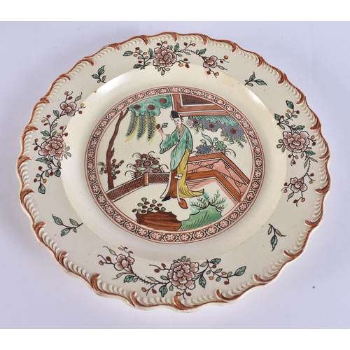 60E - A LATE 18TH/19TH CENTURY ENGLISH CREAMWARE SCALLOPED PLATE painted with an Oriental figure holding a... 