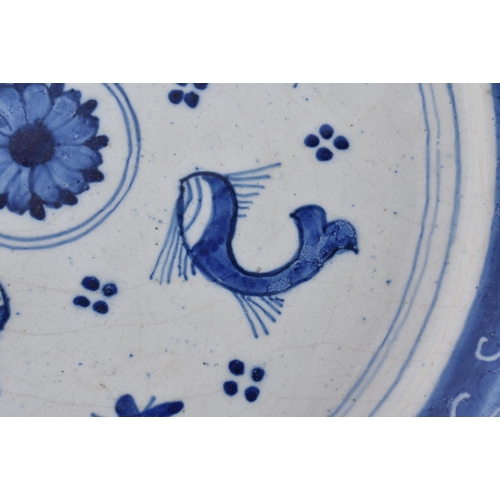 60F - A RARE 18TH CENTURY DELFT BLUE AND WHITE TIN GLAZED DISH together with two others. 21.5 cm wide. (3)