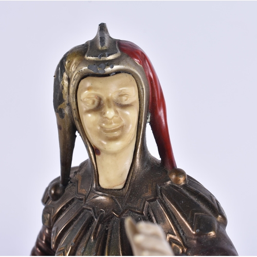 649 - AN ART DECO COLD PAINTED SPELTER FIGURE OF A JESTER. 30 cm high.