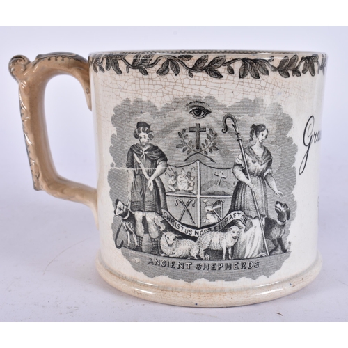 654 - A MID 19TH CENTURY ENGLISH BLACK AND WHITE POTTERY MUG. 15 cm wide.