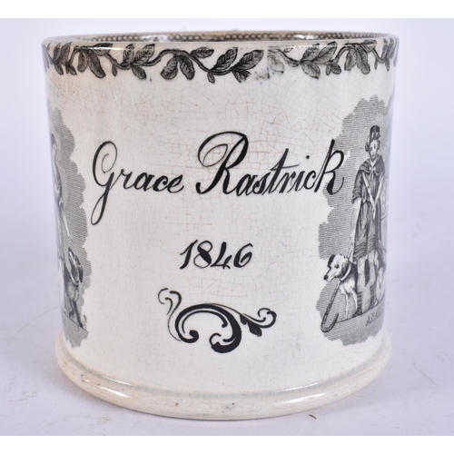654 - A MID 19TH CENTURY ENGLISH BLACK AND WHITE POTTERY MUG. 15 cm wide.