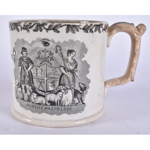 654 - A MID 19TH CENTURY ENGLISH BLACK AND WHITE POTTERY MUG. 15 cm wide.