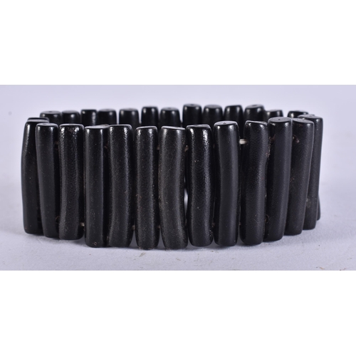 659 - A BLACK CORAL STICK BRACELET. 19 cm long.