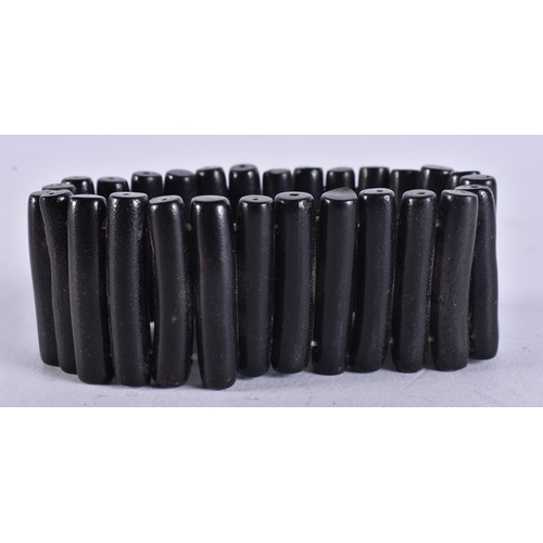 659 - A BLACK CORAL STICK BRACELET. 19 cm long.