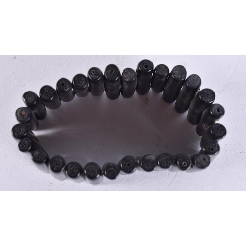 659 - A BLACK CORAL STICK BRACELET. 19 cm long.