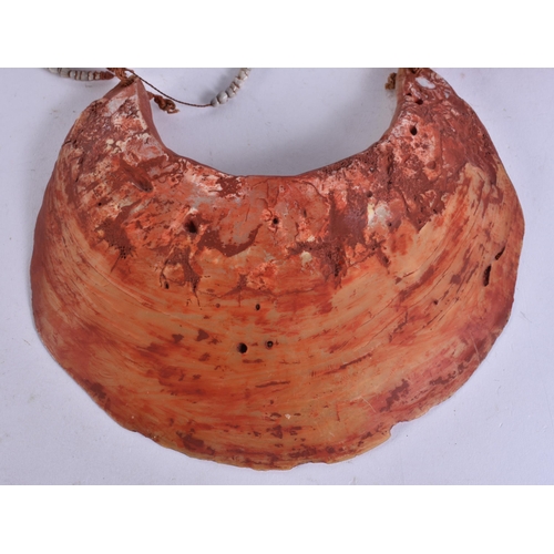 676 - A PAPUA NEW GUINEA TRIBAL SHELL CURRENCY NECKLACE. Shell 24 cm x 18 cm.