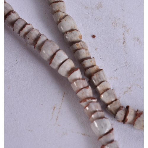 676 - A PAPUA NEW GUINEA TRIBAL SHELL CURRENCY NECKLACE. Shell 24 cm x 18 cm.