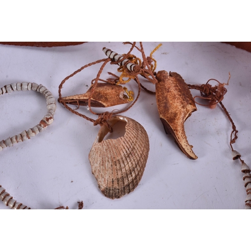 676 - A PAPUA NEW GUINEA TRIBAL SHELL CURRENCY NECKLACE. Shell 24 cm x 18 cm.