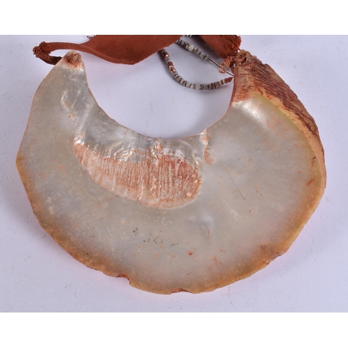 676 - A PAPUA NEW GUINEA TRIBAL SHELL CURRENCY NECKLACE. Shell 24 cm x 18 cm.