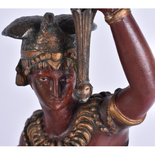 686 - A PAIR OF COLD PAINTED NATIVE AMERICAN FIGURAL CANDLESTICKS. 38 cm high.