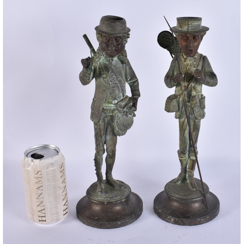 708 - A PAIR OF ART DECO SPELTER NOVELTY FISHERMAN CANDLESTICKS. 34 cm high.