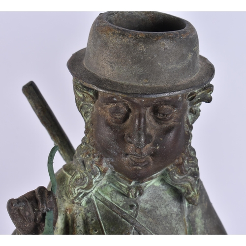 708 - A PAIR OF ART DECO SPELTER NOVELTY FISHERMAN CANDLESTICKS. 34 cm high.