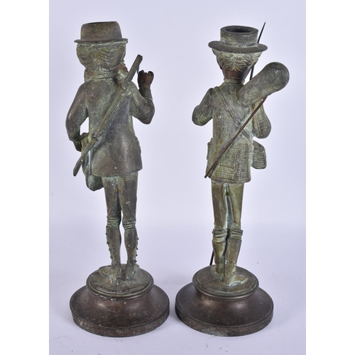 708 - A PAIR OF ART DECO SPELTER NOVELTY FISHERMAN CANDLESTICKS. 34 cm high.