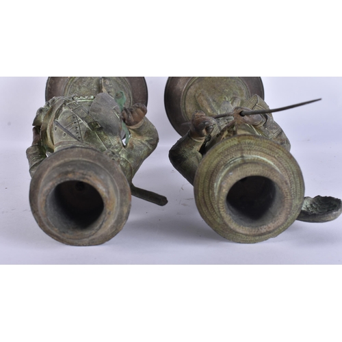 708 - A PAIR OF ART DECO SPELTER NOVELTY FISHERMAN CANDLESTICKS. 34 cm high.