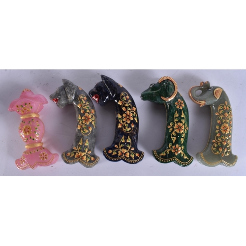 735 - FIVE ISLAMIC LACQUERED STONE DAGGER HANDLES. 17 cm long. (5)