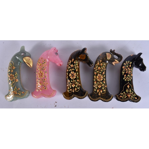 736 - FIVE ISLAMIC LACQUERED STONE DAGGER HANDLES. 17 cm long. (5)