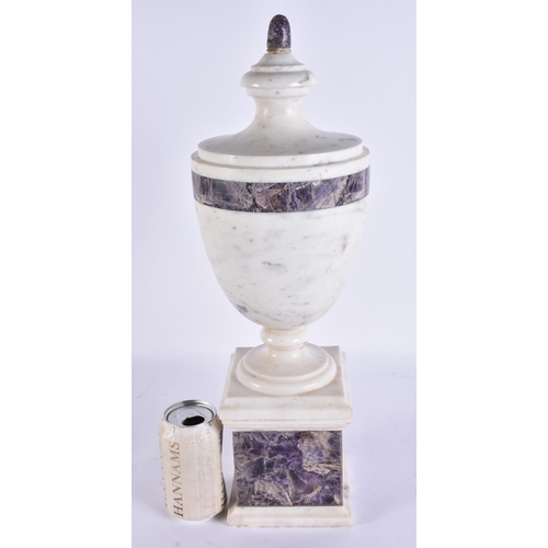 738 - A LARGE CARVED STONE AND AMETHYST ADAMS STYLE URN. 47 cm high.