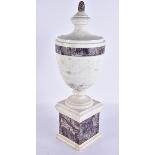738 - A LARGE CARVED STONE AND AMETHYST ADAMS STYLE URN. 47 cm high.