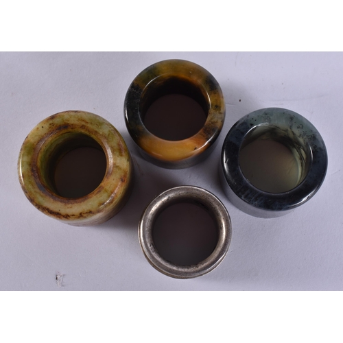 754 - FOUR CHINESE ARCHERS RINGS. (4)