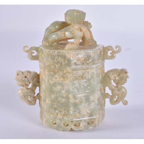 757 - A CHINESE TWIN HANDLED JADE BOX AND COVER. 8 cm high.