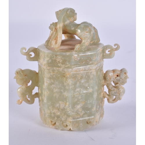757 - A CHINESE TWIN HANDLED JADE BOX AND COVER. 8 cm high.