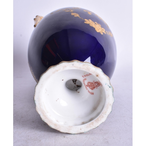 808 - Royal Crown Derby two handle vase with blue and gilt ground painted with a flying bird in landscape ... 