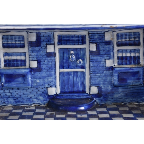 80A - A RARE ANTIQUE DELFT TIN GLAZED BLUE AND WHITE MAKKUMER HUIS POTTERY BOX AND COVER. 18 cm x 18 cm.