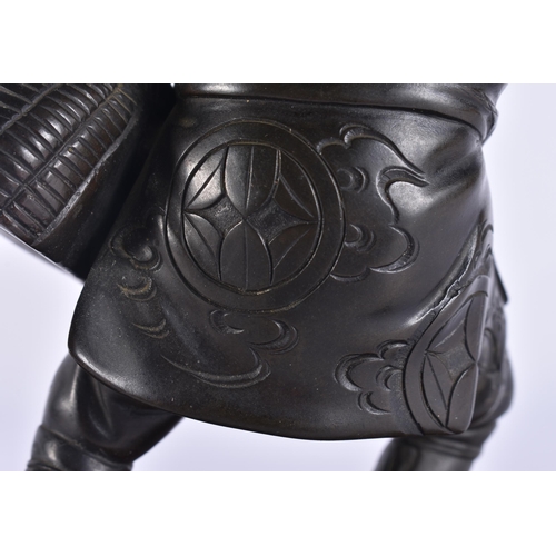 80C - A 19TH CENTURY JAPANESE MEIJI PERIOD BRONZE OKIMONO modelled as a male with a speared bird. Bronze 2... 