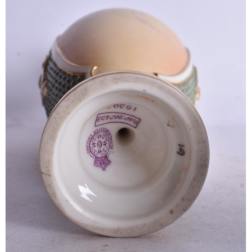 843 - Royal Worcester two handled vase painted with flowers on a blush ivory ground date code 1898. 26cm