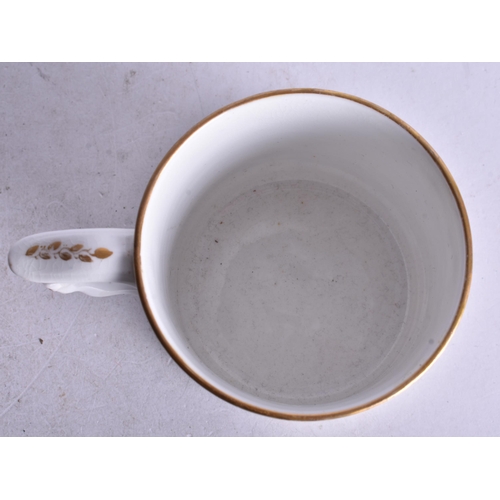 876 - Early 19th century Derby mug painted with a table of flowers in a basket. 7.5cm height