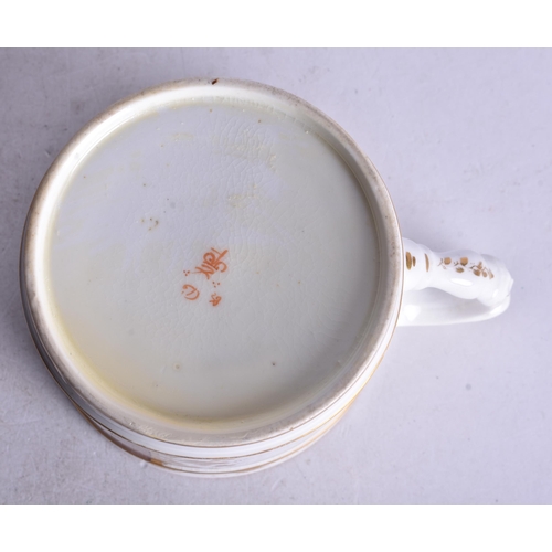 876 - Early 19th century Derby mug painted with a table of flowers in a basket. 7.5cm height