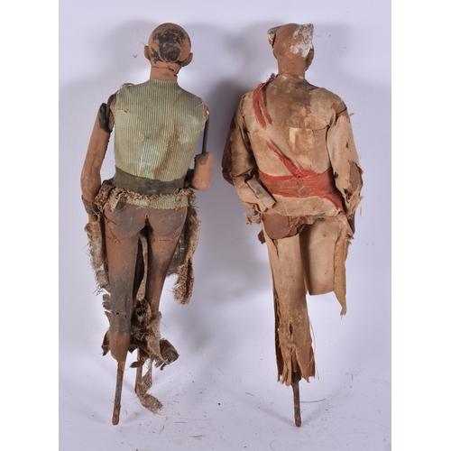 93 - AN UNUSUAL PAIR OF 19TH CENTURY INDIAN COMPANY BOMBAY SCHOOL FIGURES. 30 cm long.
