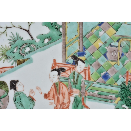 932 - A LARGE EARLY 18TH CENTURY CHINESE FAMILLE VERTE PORCELAIN DISH painted with ladies and others in a ... 