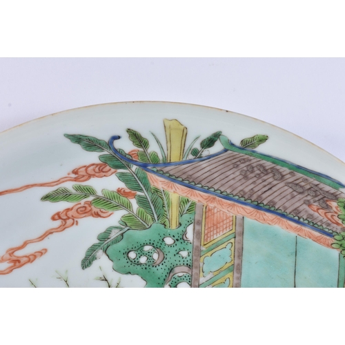 932 - A LARGE EARLY 18TH CENTURY CHINESE FAMILLE VERTE PORCELAIN DISH painted with ladies and others in a ... 