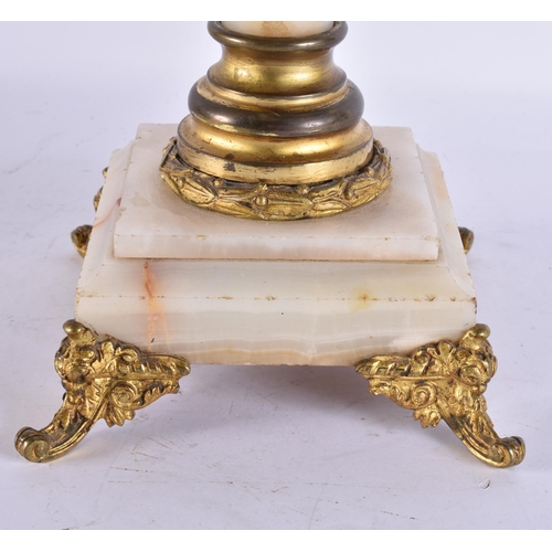 945 - A LARGE ANTIQUE BRONZE AND ONYX LAMP. 68 cm high.