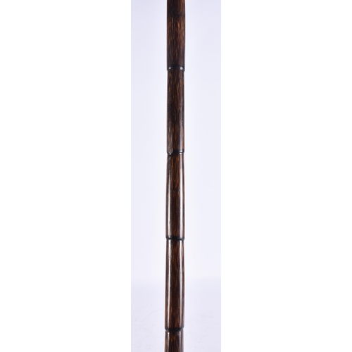 950 - A SILVER MOUNTED WALKING CANE. 90 cm long.