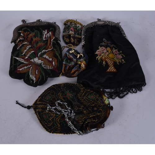 1053 - THREE ANTIQUE PURSES. (3)