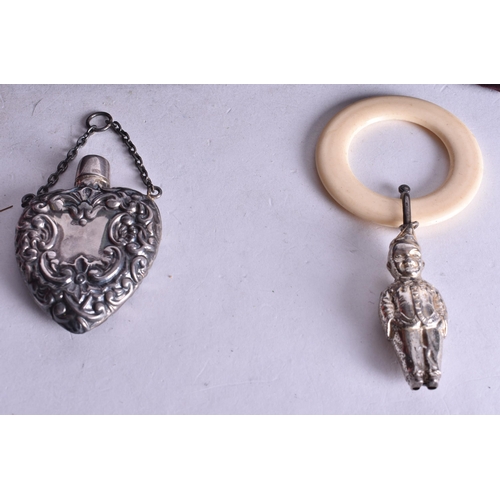 1137 - A SILVER SCENT BOTTLE together with a silver teething ring & ladies purse. Silver 33 grams. (3)