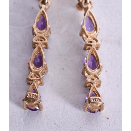 1148 - 9ct gold amethyst diamond drop earrings (2g). 2.75 cm x 0.5 cm.