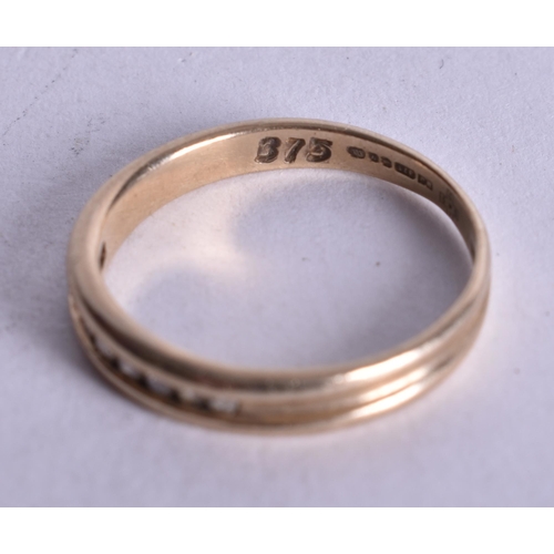 1174 - 9ct gold diamond channel set half eternity ring (1.2g). I 1/2.