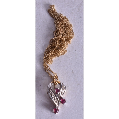 1181 - 18ct gold ruby diamond pendant on 9ct gold chain (1.8g). 45 cm long, pendant 1.5 cm x 0.75 cm.