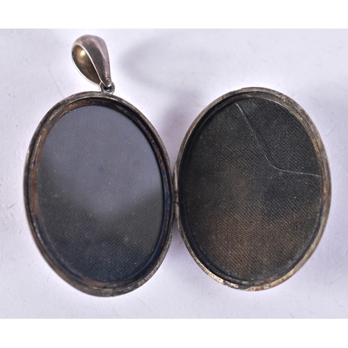 1253 - Sterling Silver Antique Locket (36g). 6 cm x 3 cm.